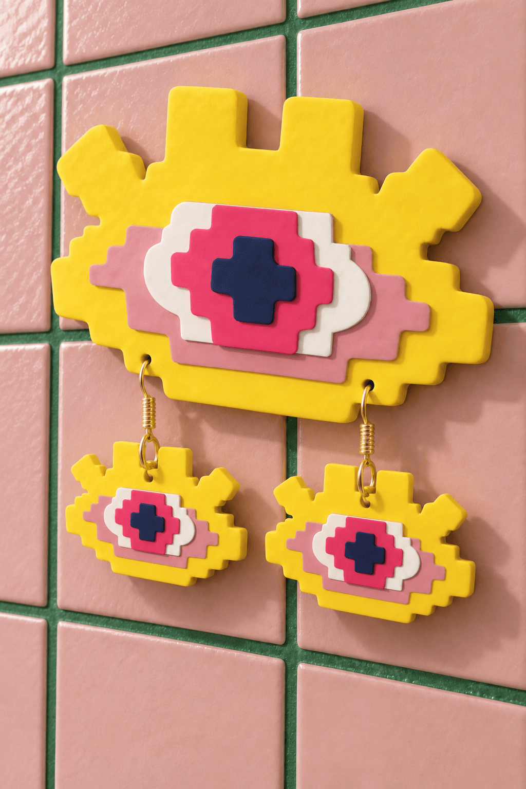 Signature eye wall display with matching drop earrings on studio tiles.