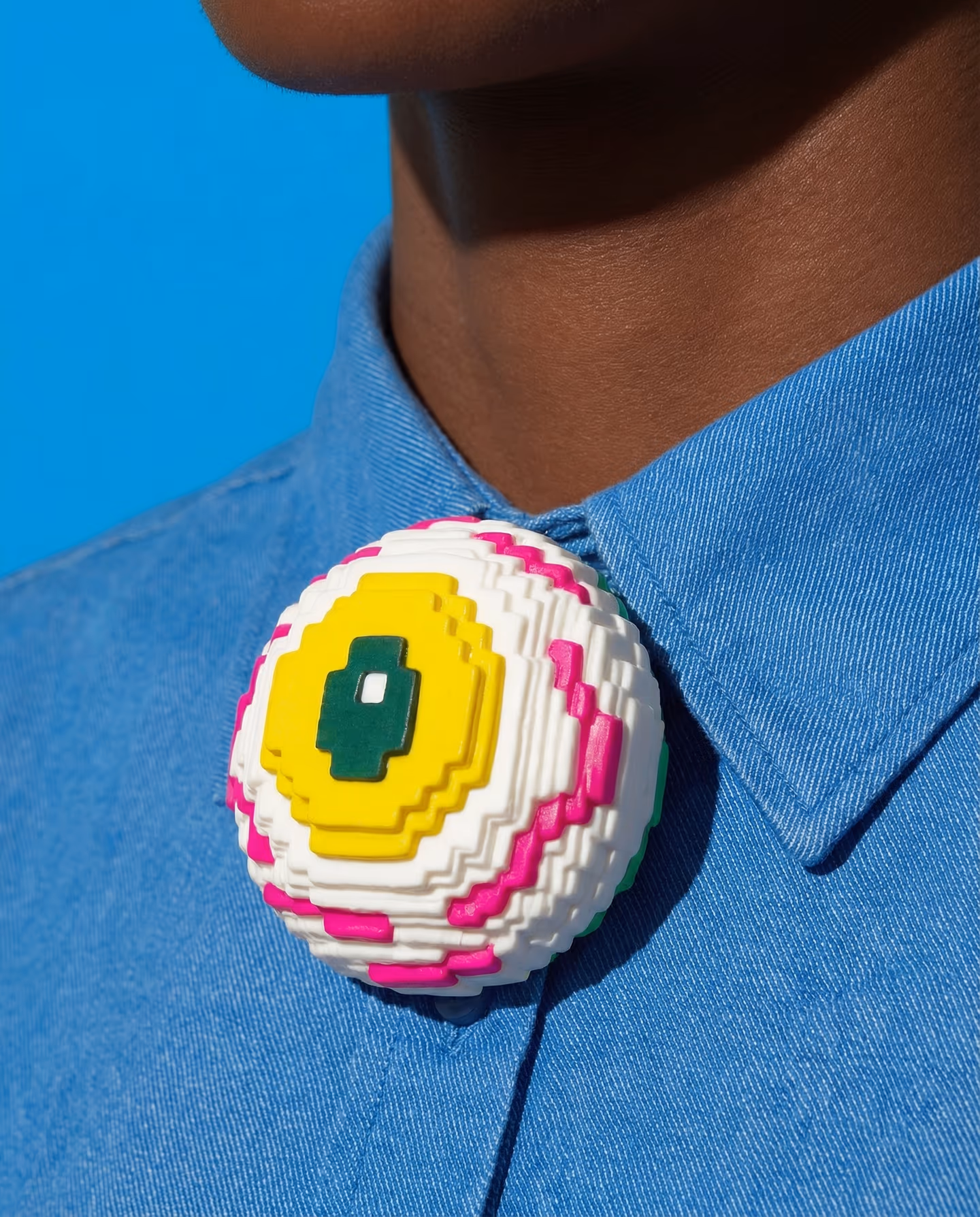 Stepped Pixel Eyeball Dome Brooch in styled context. Start with a broad domed base and stack equal-thickness pixel slabs from the iris outward, because the pair reads like a stepp…