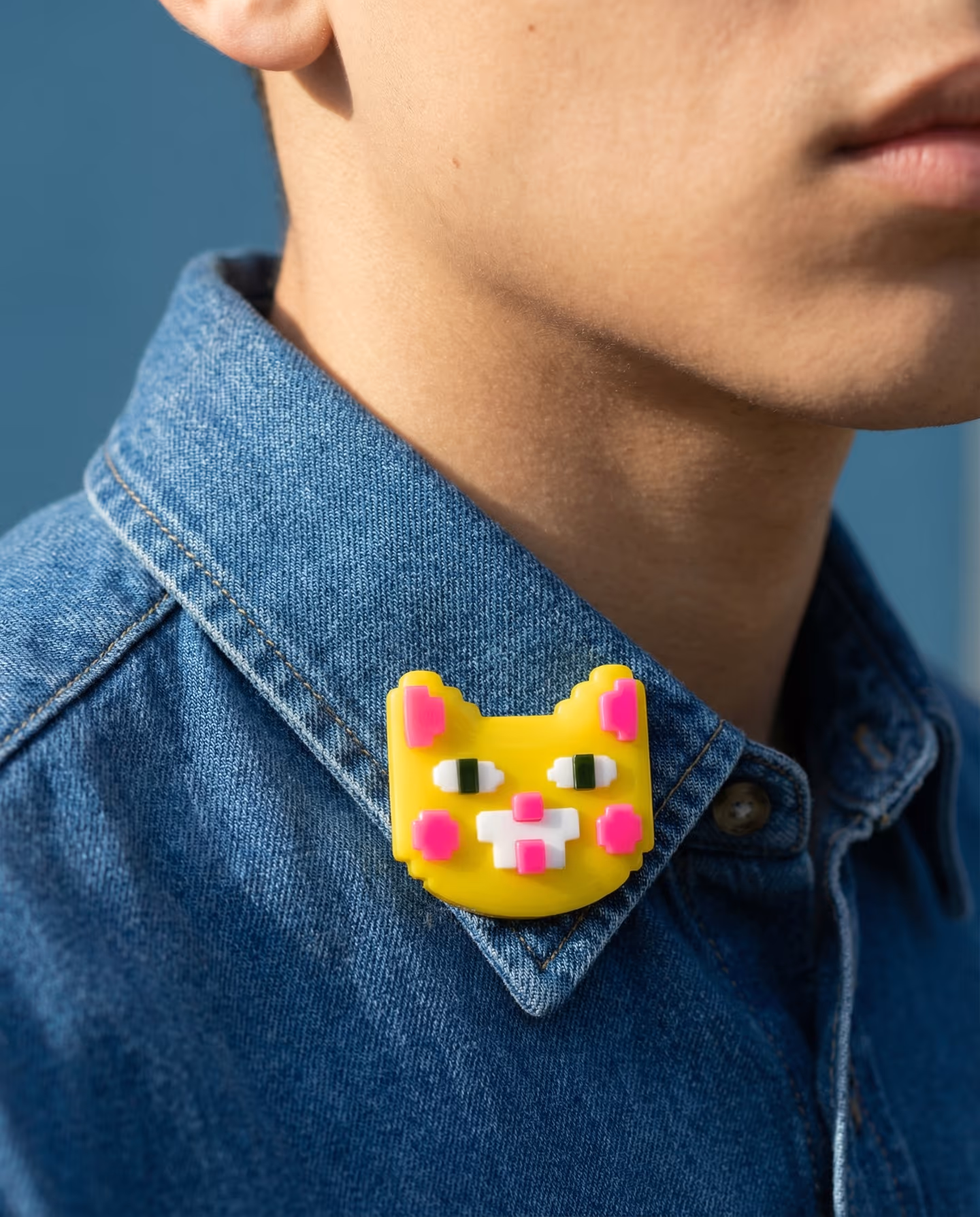 Yellow Pixel Cat Brooch in styled context. Start with one yellow cat-face plaque and keep the cheeks, ears, and muzzle as separate pieces, because the pair reads as a flat badge w…