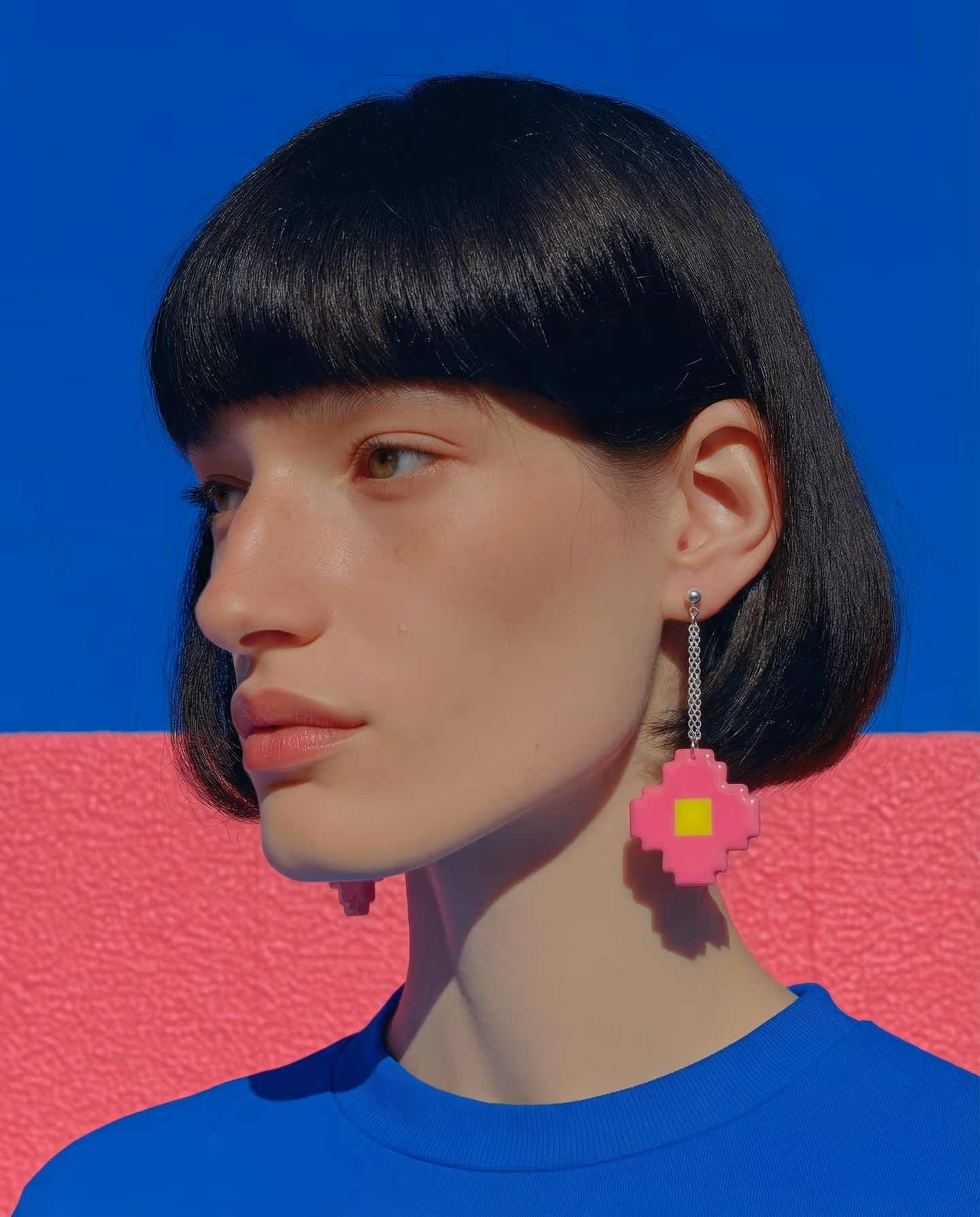 Hot Pink Pixel Cross Chain Drops in styled context. Start with the hot-pink cross plaque and a separate yellow center square, because the image pair shows one flat stepped cross h…