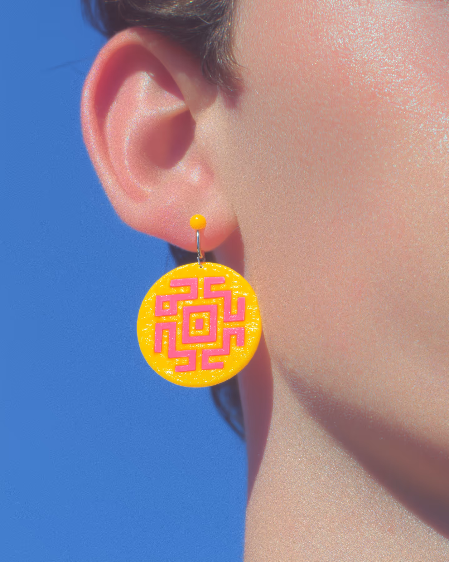 Yellow Maze Disc Drop Earrings in styled context. Build the maze from the center out. The yellow disc is simple, but the raised pink route needs a paper template, consistent strip…